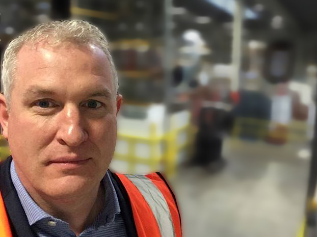 kieran perry business coach in client warehouse